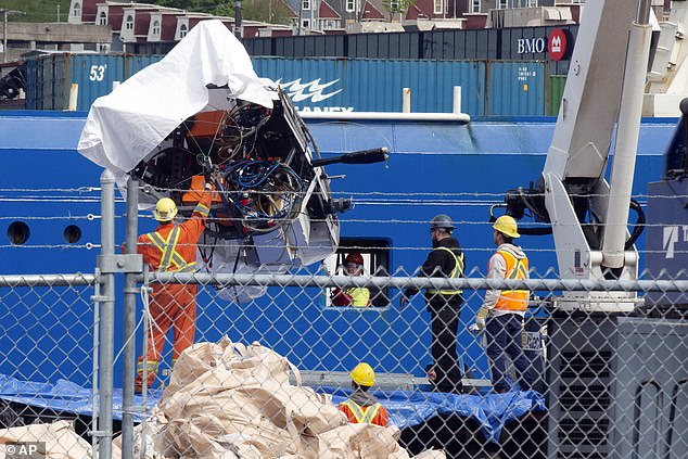 Huge chunks of metal are unloaded from the Horizon Arctic ship at the Canadian Coast Guard pier in St John's, Newfoundland, Canada