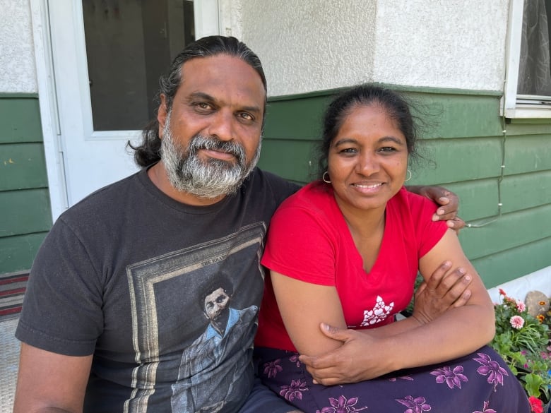 Siva and Lavanya Canjeevaram pose in front of their Calgary home. 