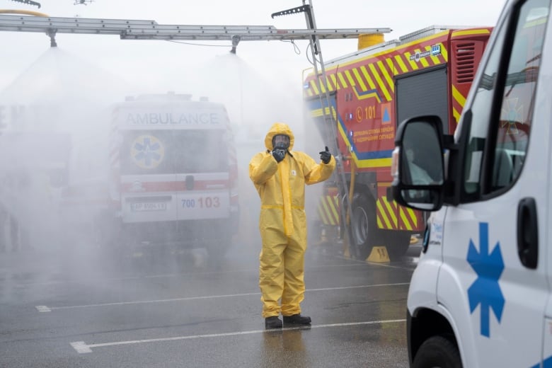 A Ukrainian emergency worker wearing radiation protection suit attends training in Zaporizhzhia, Ukraine, last month.