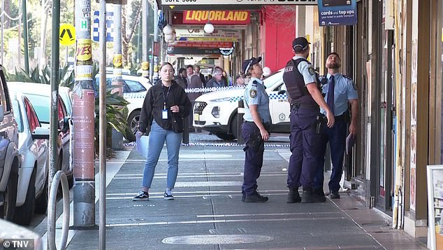 Police are seen in Marrickville after two men were shot