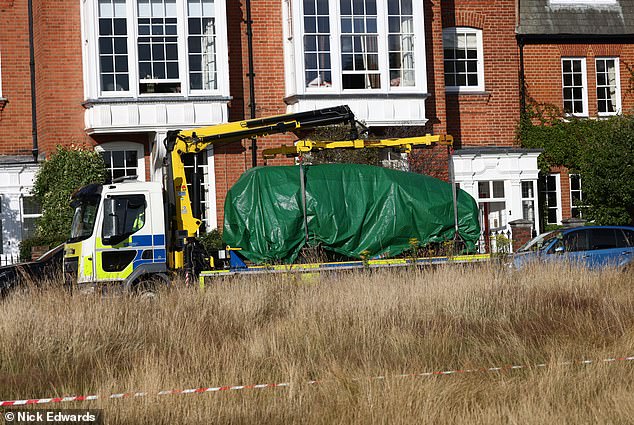 The 4x4 was taken away from the school on Thursday evening, covered by a green tarpaulin