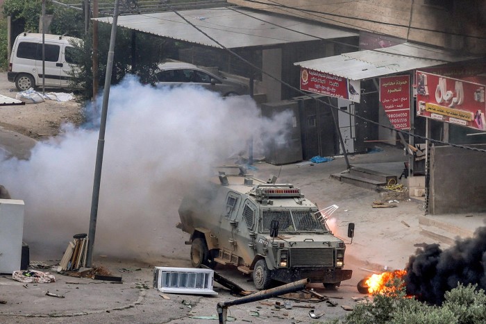 An explosive charge left by Palestinians detonates near an Israeli armoured vehicle during an Israeli army raid in Jenin last month