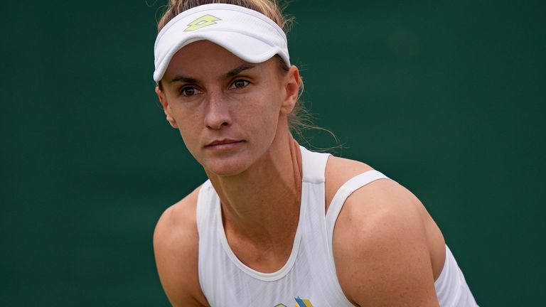 Ukraine&#39;s Lesia Tsurenko, sports a Ukrainian flag ribbon on her outfit as she plays Claire Liu of the US in a first round women&#39;s singles match on day one of the Wimbledon tennis championships in London, Monday, July 3, 2023. (AP Photo/Alberto Pezzali)