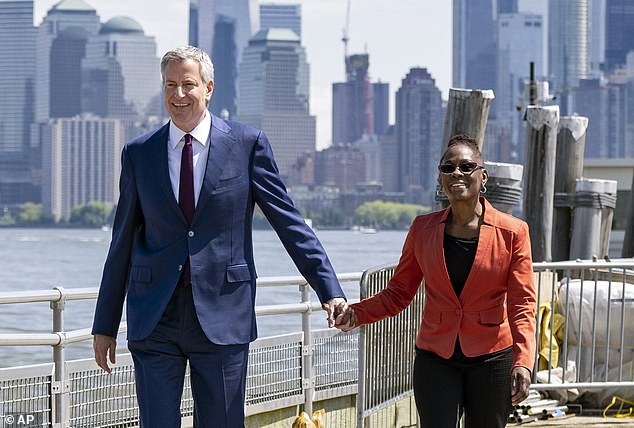 The pair, pictured here,  became one of the most high-profile bi-racial couples in American politics when they tied the knot in 1994