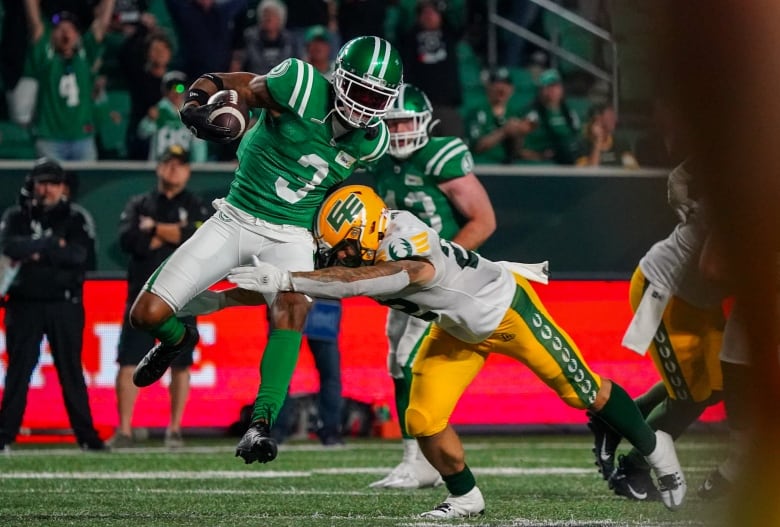 Saskatchewan Roughriders defensive back Nic Marshall (3) runs after an interception against the Edmonton Elks during the second half of CFL football action in Regina, on Thursday, July 6, 2023. 