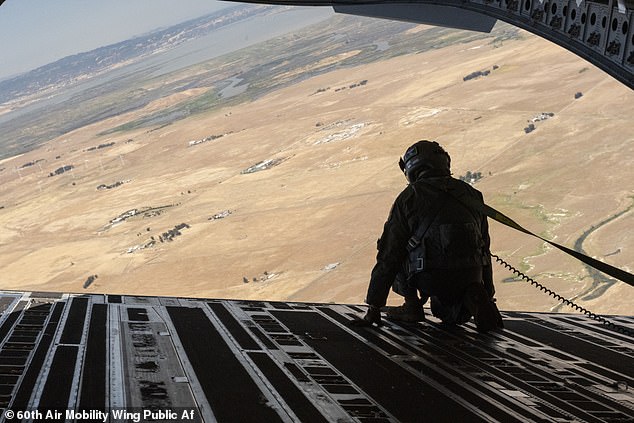 Many of the aircraft housed at the Travis Air Force base are large military transport aircraft such as C-5s and C-17s. Pictured is a Sgt. looking over the open aircraft ramp of a 62nd Airlift Wing C-17