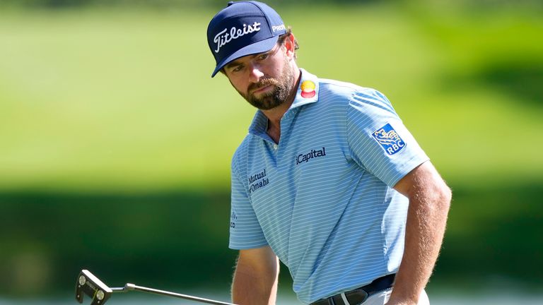 Leader Cameron Young watches his putt on the 18th hole during the second round of the John Deere Classic