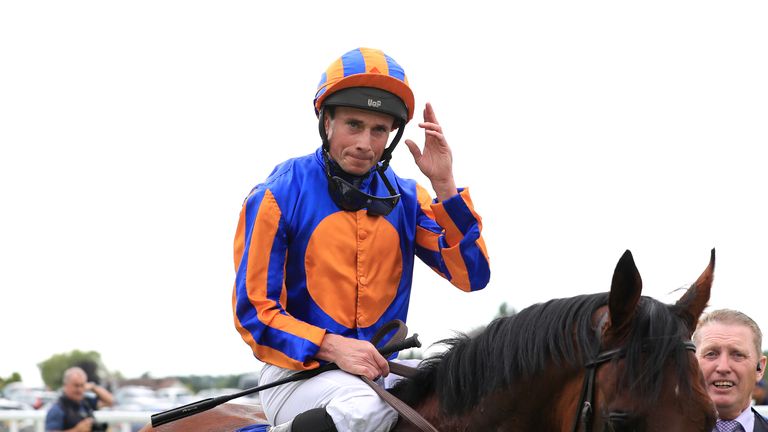 Ryan Moore salutes the Sandown crowd after Paddington&#39;s victory