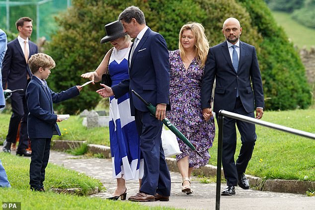 Broadcaster Jon Sopel (middle) and former chancellor and health secretary Sajid Javid were pictured at the venue today