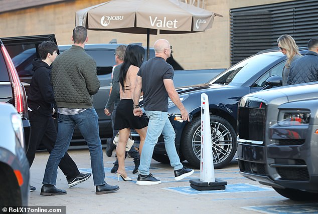 Wearing all black, Sanchez's son, Nikko, trailed the loved-up couple as they made their entrance to the restaurant