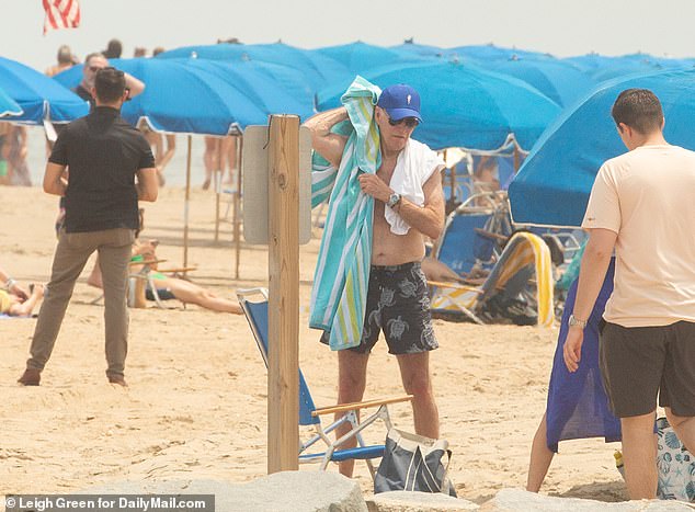 The president is seen enjoying the beach on Saturday with his family