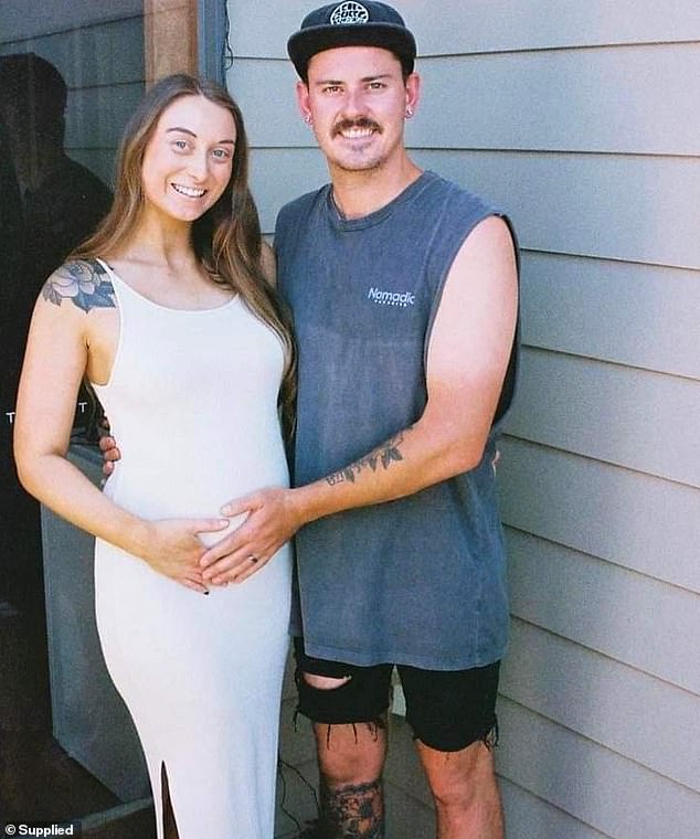 Taylor and her husband Jesse (pictured together) were delighted to become pregnant after trying three-and-a-half years to conceive