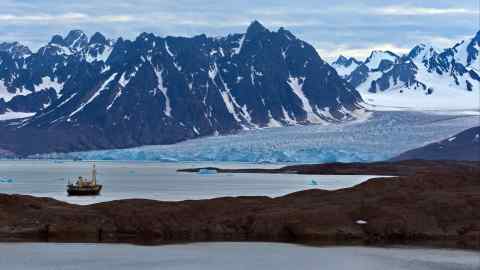 A fishing vessel on the icy waters of Svalbard