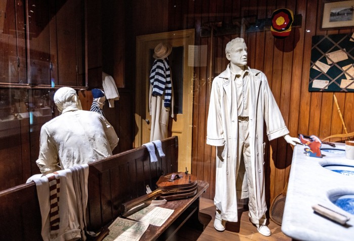 The gentlemen’s dressing room section of the museum, with mannequins of men in early 20th-century tennis outfits and memorabilia including old-fashioned rackets 