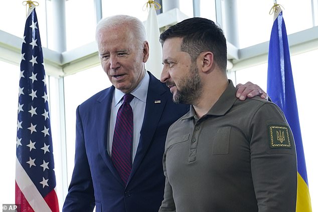 The US President, pictured with Ukraine's Volodymyr Zelenskyy, has agreed to send cluster bombs to Kyiv