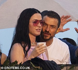 Sweet: Orlando whispered sweet nothings into Katy's ear