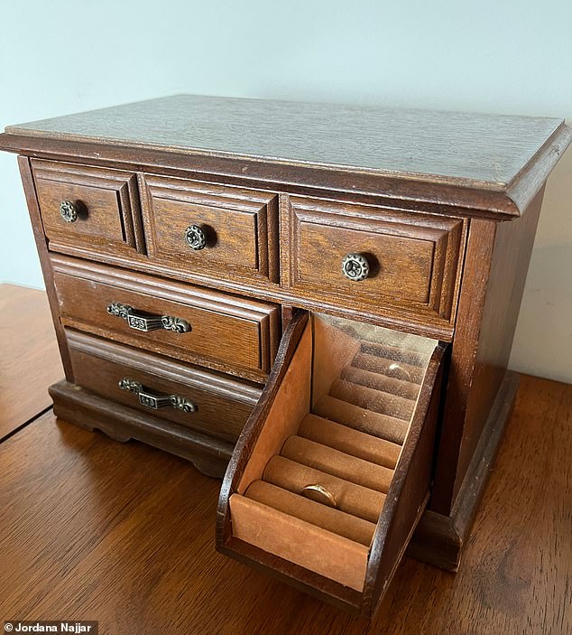 The photo shows a now-empty wooden jewlery box that was filled with rings and family heirlooms. The resident was devastated that her mother's wedding ring handed down to her was stolen too. The thieves only left one ring behind