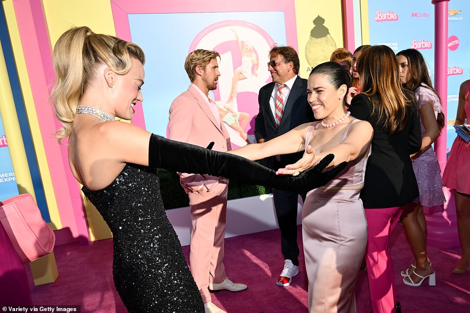 Hey girl! Margot seemed especially pleased to see Emmy winner America Ferrera (R), who plays a Mattel employee called Gloria who visits Barbieland