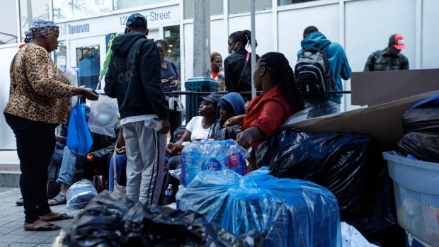 Hundreds of asylum seekers, refugees forced to leave Toronto church for other shelter