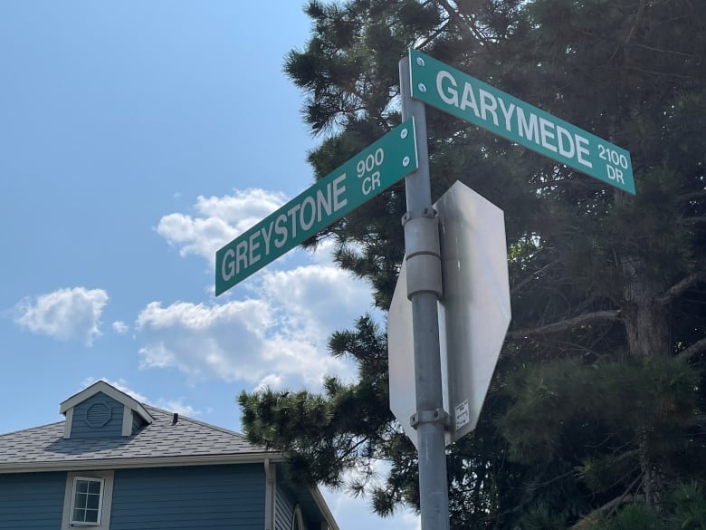 Street signs reading 'Greystone Crescent' and 'Garymede Drive.' 