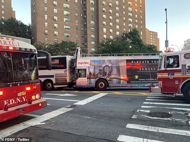 At least 80 passengers are injured after tour bus crash on major New York City intersection 