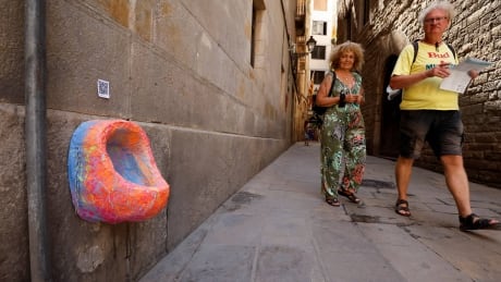 Barcelona artist installs urinals as protest against visitors peeing on walls