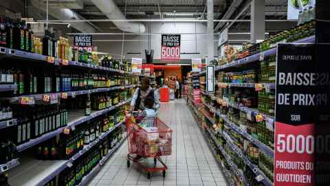 A customer shops in a Casino Hyperfrais hypermarket in France