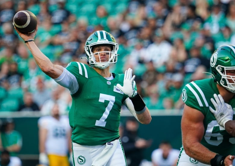 Saskatchewan Roughriders quarterback Trevor Harris (7) throws against the Edmonton Elks during the first half of CFL football action in Regina, on Thursday, July 6, 2023.