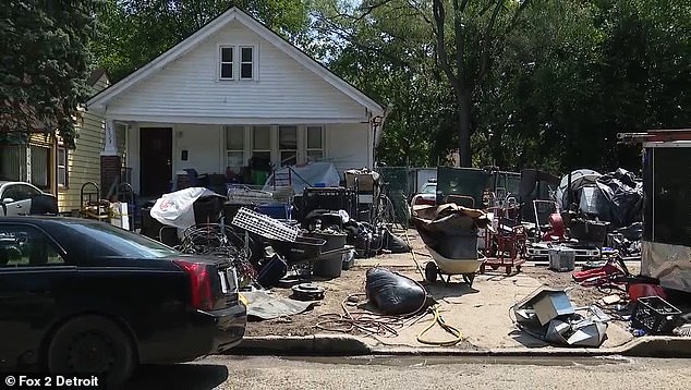 Detroit residents slam homeowner for his ‘eyesore junkyard’ and accuse him of dodging $11k in fines