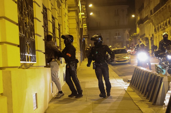 The police detain a young man