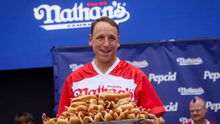 Joey Chestnut eats 62 hot dogs to claim 16th Mustard Belt