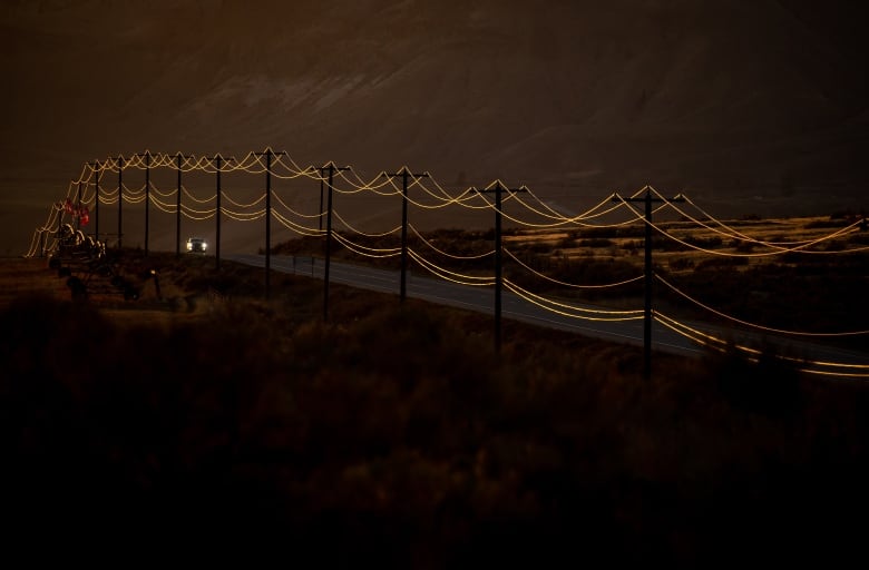 Sunlight reflects off power lines running along a stretch of the Trans-Canada Highway in B.C.