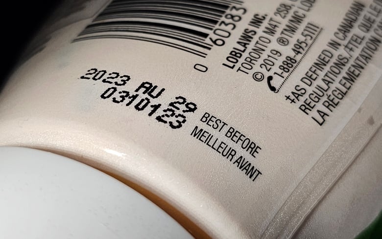 A "best before" date is shown on a food container.