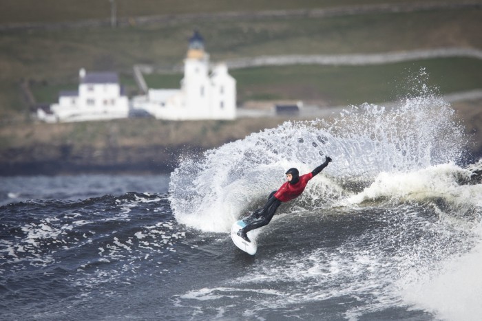 A surfer off Thurso in northern Scotland