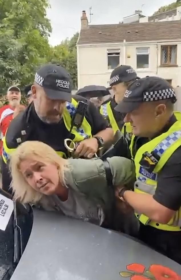 Protesters clash with police at demo outside hotel that sacked staff to make room for asylum seekers