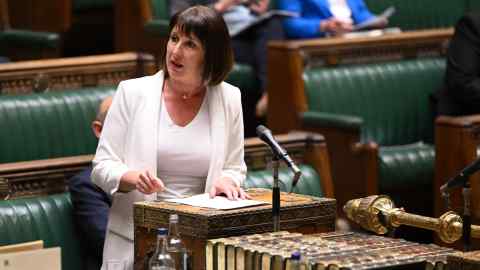 Shadow chancellor Rachel Reeves in a white outfit at the lectern in parliament