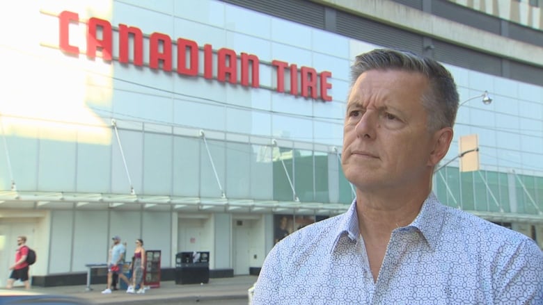 Canadian Tire customer, Brian Simpson standing in front of the store. 