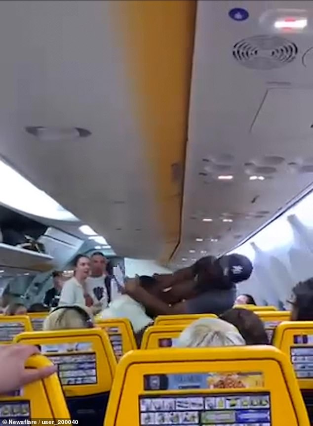 Shocking footage shows two men brawling on Ryanair plane after argument over seat