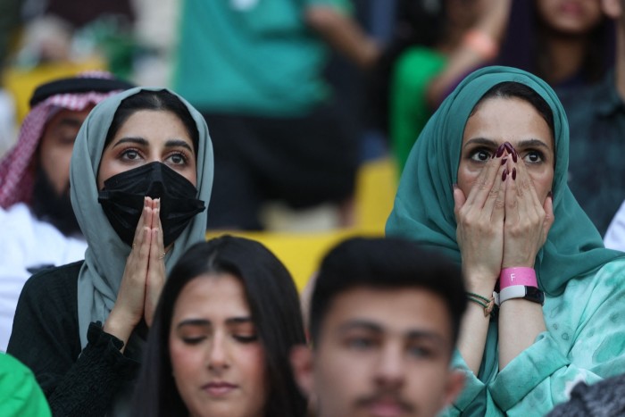 Saudi fans watch football match