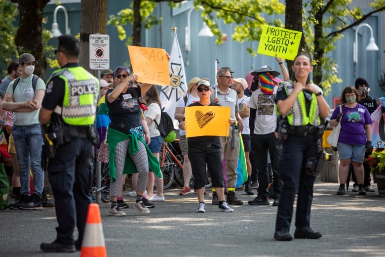 Conter-protesters stand outside the Carousel Theatre for Young People in Vancouver, B.C.