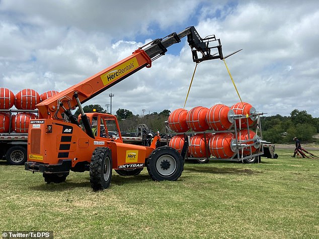 Texas rolls out huge buoys across 1,000ft of the Rio Grande