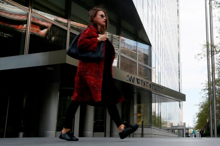 A woman walking outside the Goldman headquarters in New York