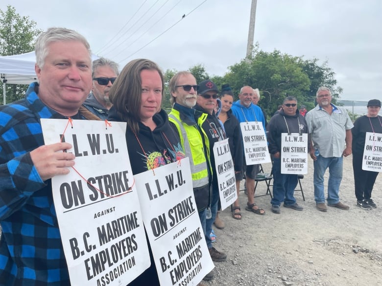 Port workers are pictured in Prince Rupert, B.C.