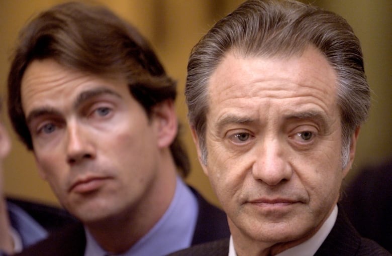 Postmedia boss Paul Godrey in 1998 when he was president of Sun Media with then Quebecor Inc. Vice-President Pierre Karl Peladeau (L) during one a series of mergers and takeovers that resulted in a consolidation in Canada`s newpaper sector.