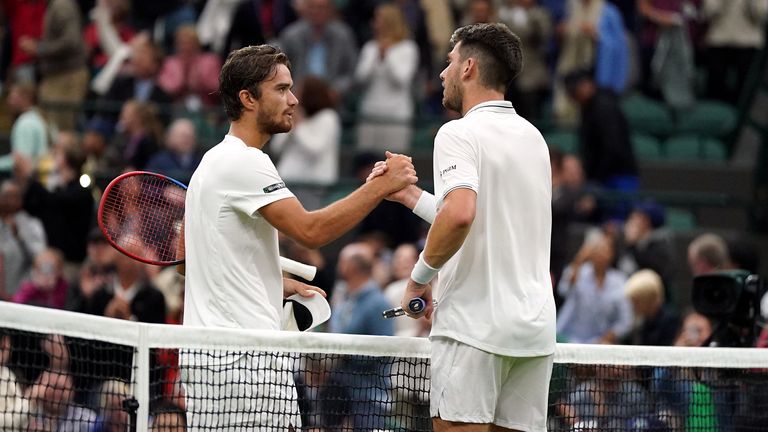 Machac and Norrie shake hands at the net 