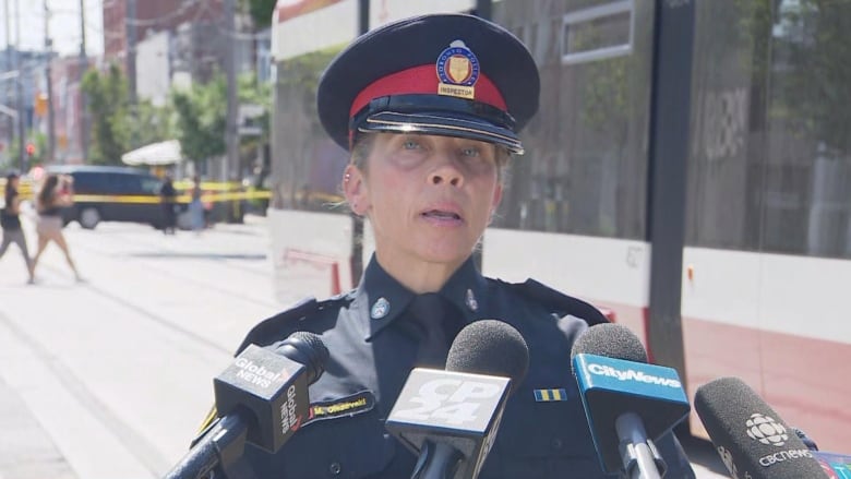 Duty Insp. Michelle Olszevski providing an update to reporters on a daylight shooting near Queen Street and Carlaw Avenue on Friday afternoon. 