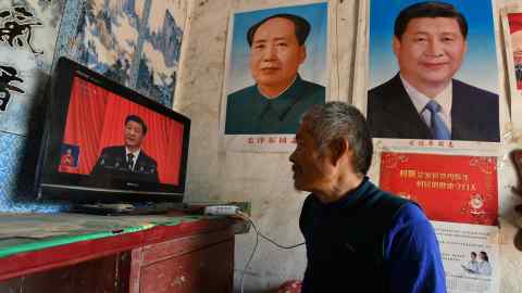 A villager watches the 20th national congress of China’s Communist party in October last year