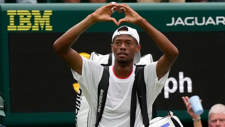 Christopher Eubanks of the US gestures to the crowd after losing to Russia&#39;s Daniil Medvedev in their men&#39;s singles match on day ten of the Wimbledon tennis championships in London, Wednesday, July 12, 2023. (AP Photo/Alastair Grant)