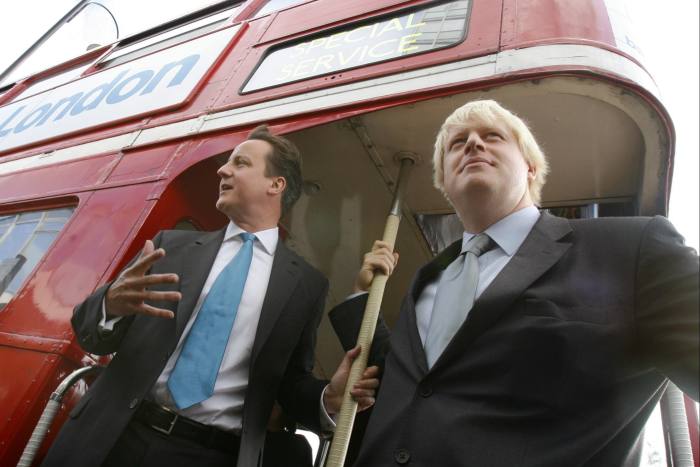 David Cameron and Boris Johnson boards a branded London bus