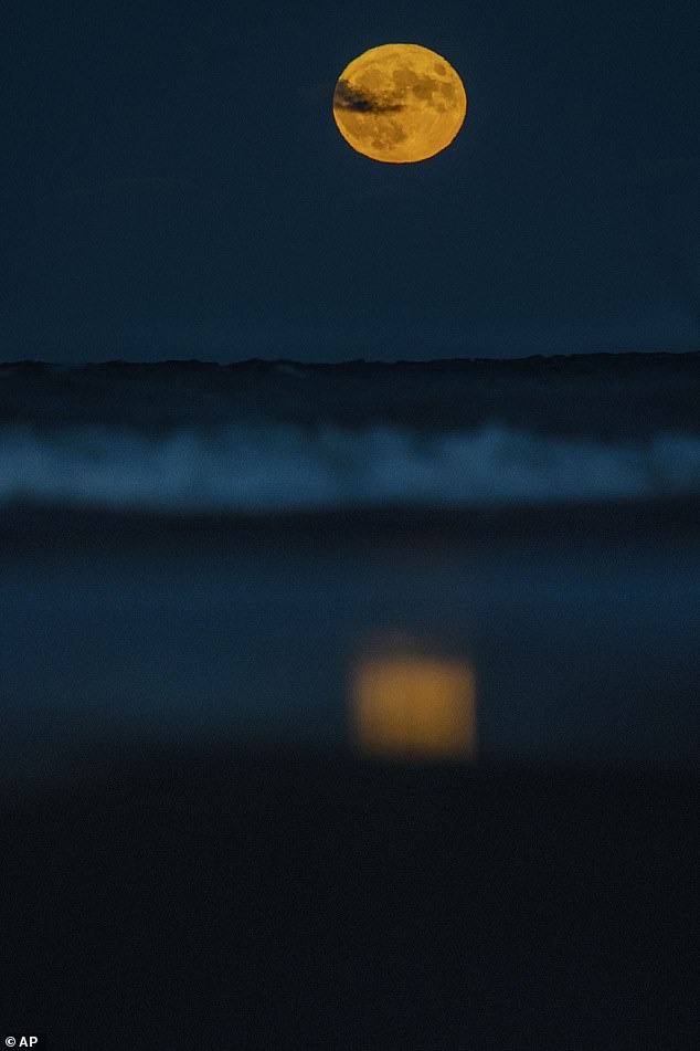 LAKE MICHIGAN: The Blue Supermoon rises over Lake Michigan